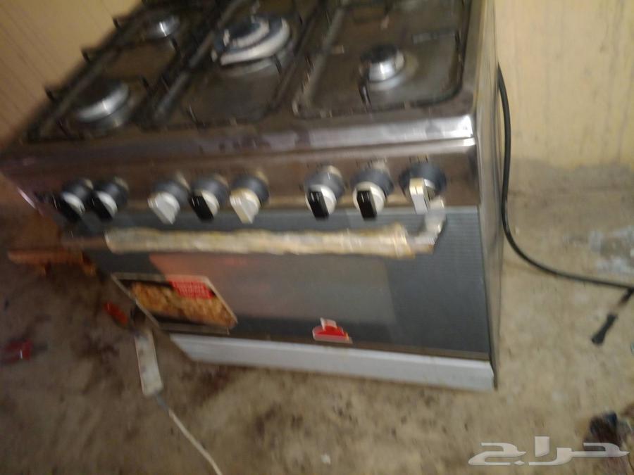 Gas stove with 5 burners, top and bottom oven, automatic ignition, almost new, and double tub washing machine63667693228546113