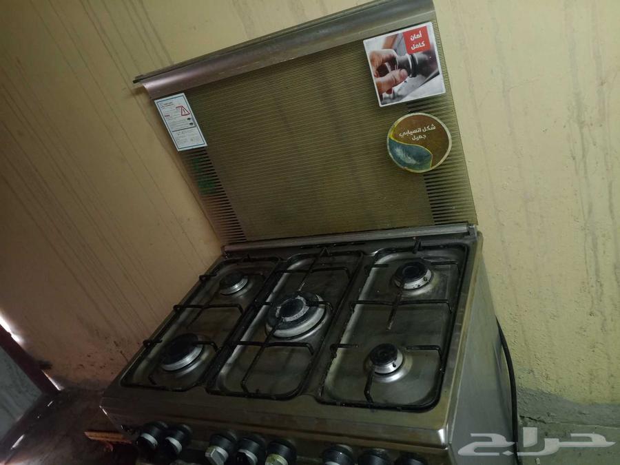 Gas stove with 5 burners, top and bottom oven, automatic ignition, almost new, and double tub washing machine63667693228546111