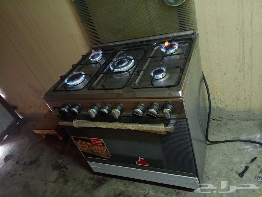 Gas stove with 5 burners, top and bottom oven, automatic ignition, almost new, and double tub washing machine63667693228546110