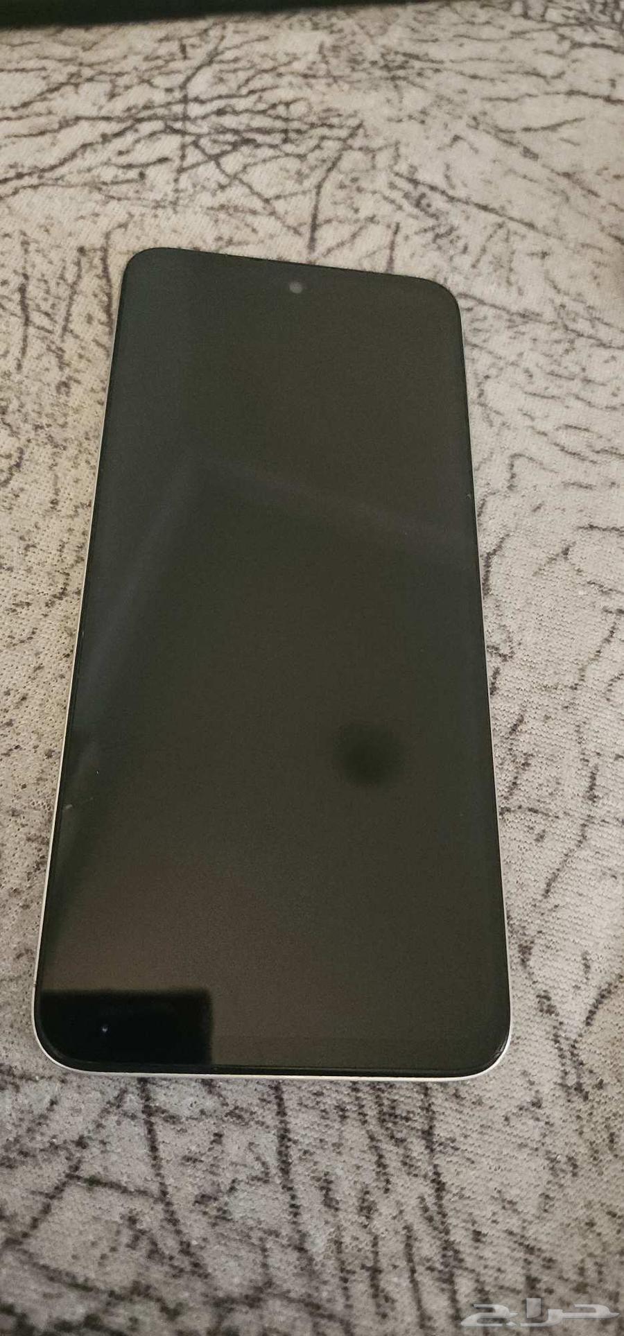 Redmi phone broken from the front with a small crack and broken from the back63700365942531111