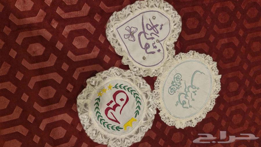 Embroidered fabric pieces attached to the newborn's sheet, name as requested63724482014339110