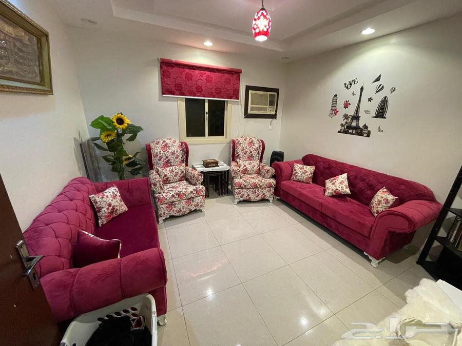 Clean used sofa with curtains and tables63728613014786110