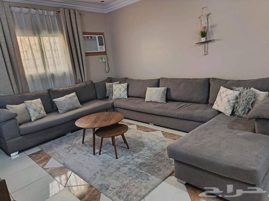 Clean sofa with two rugs and two tables63736971107202110