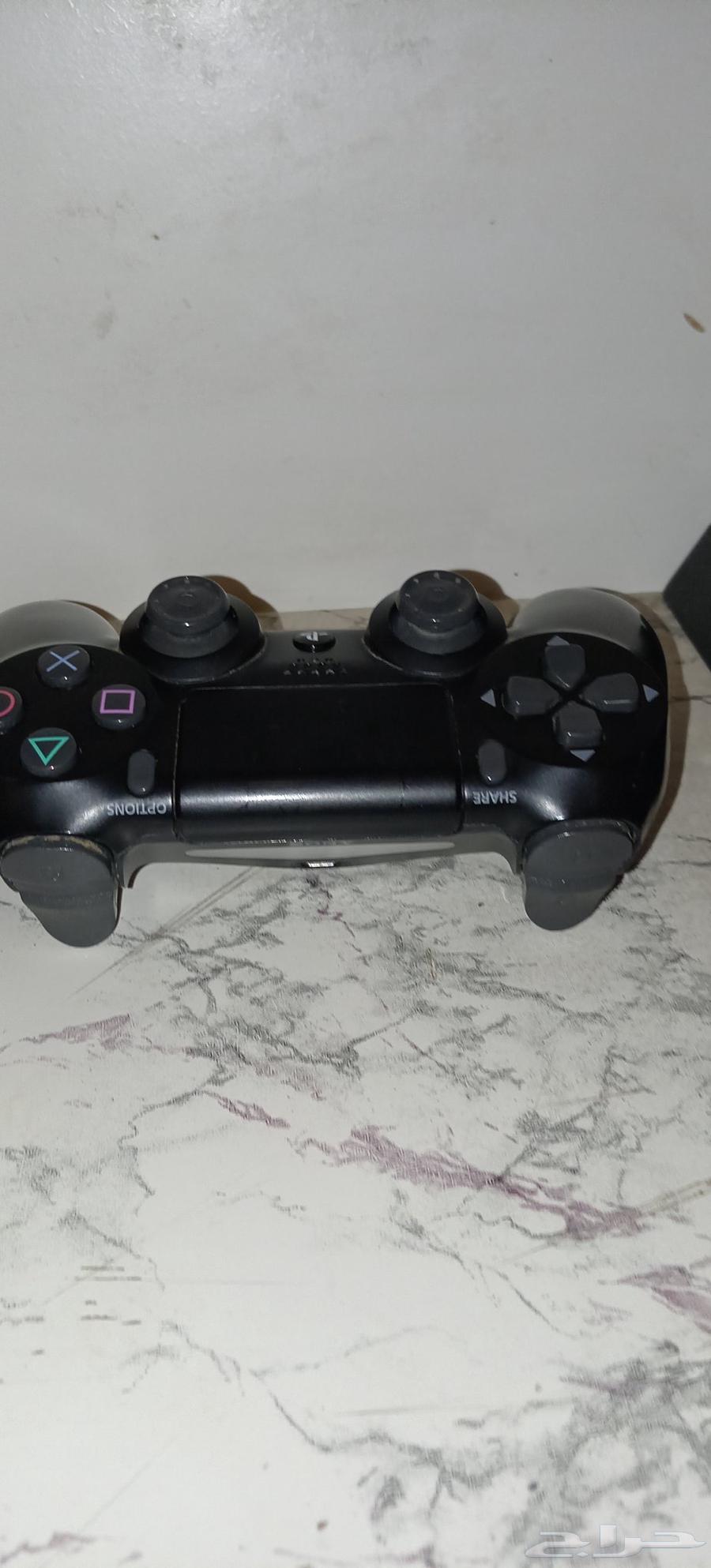 Sony 4 with original controller and Grand Theft Auto and Hitman game discs63768227279875111