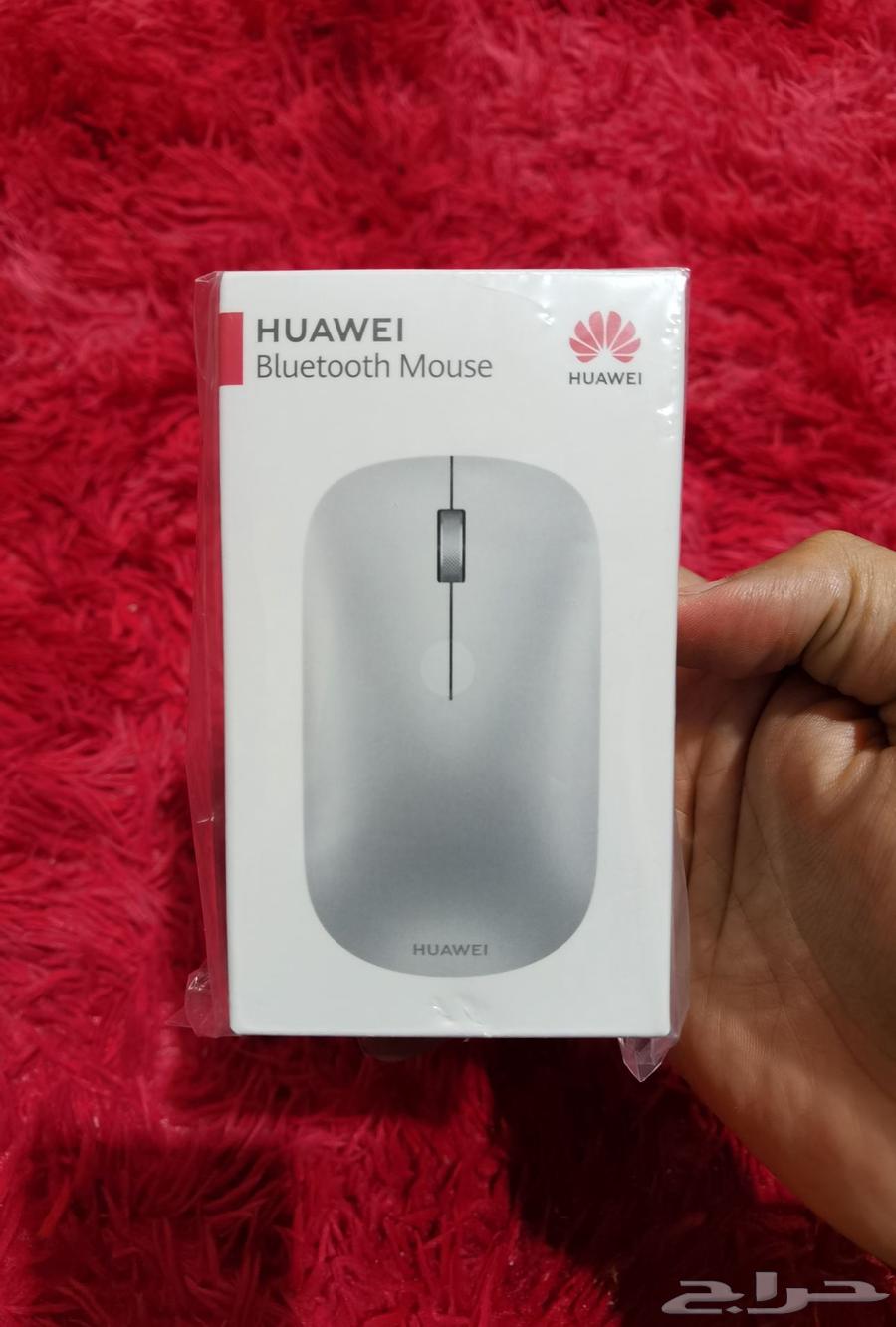 Nikon lens, mouse, and Huawei bag63390709919747111