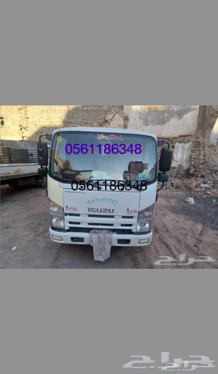 Small truck for furniture and furniture transportation within the illuminated city633815833137951123