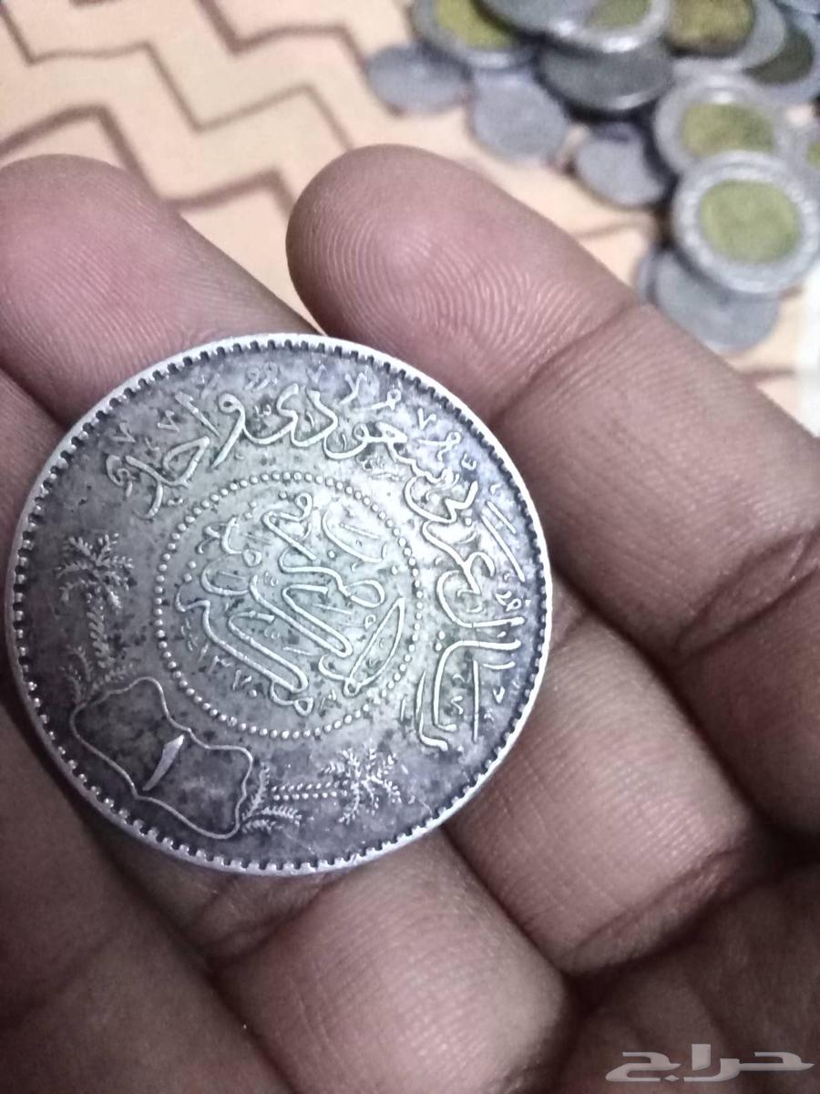 A large number of coins and a silver riyal of King Abdulaziz64148358178947111