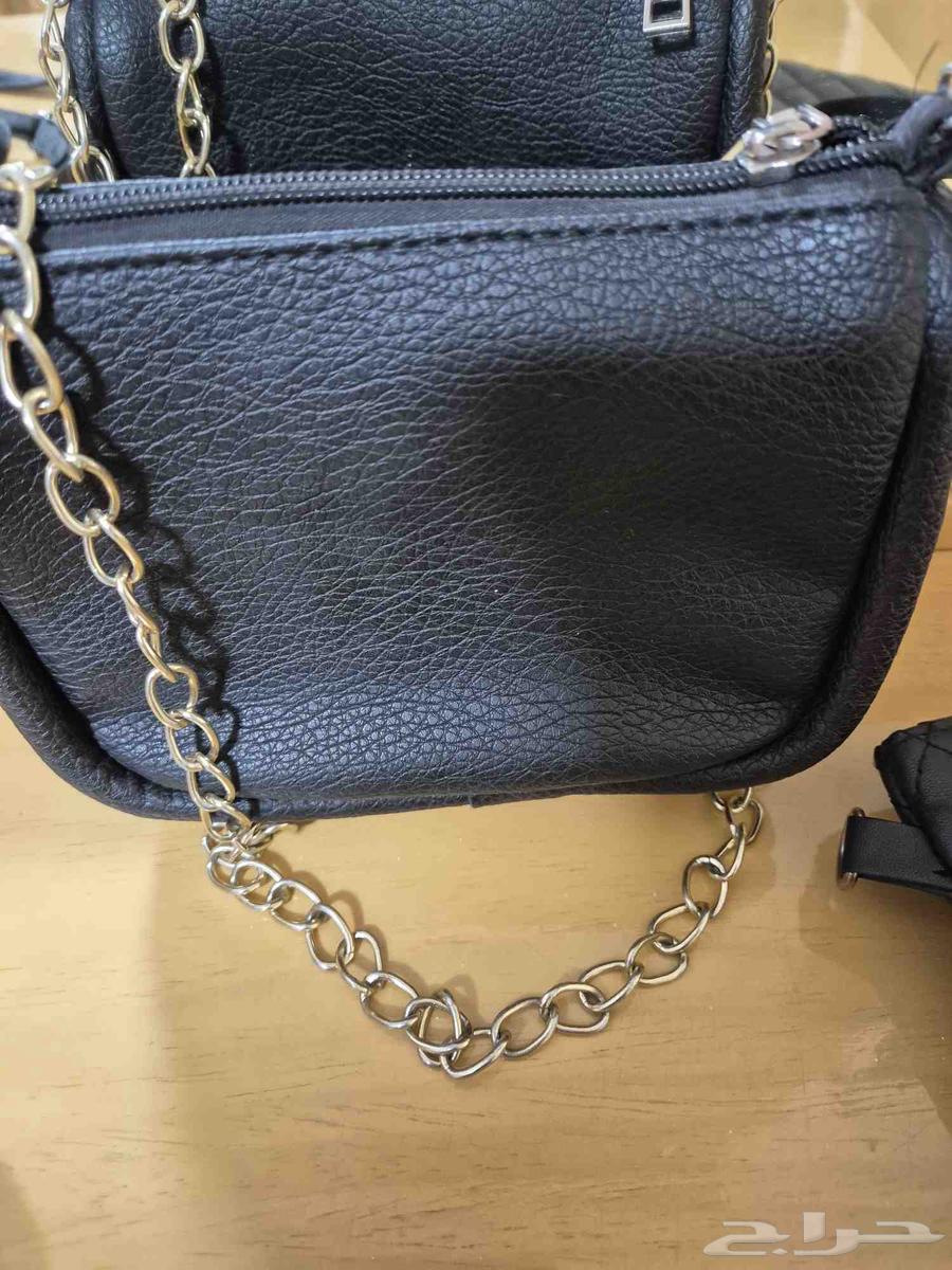 Two carpets 50 SAR, bags priced from 15 to 50 SAR, dining table 15064233486793091113