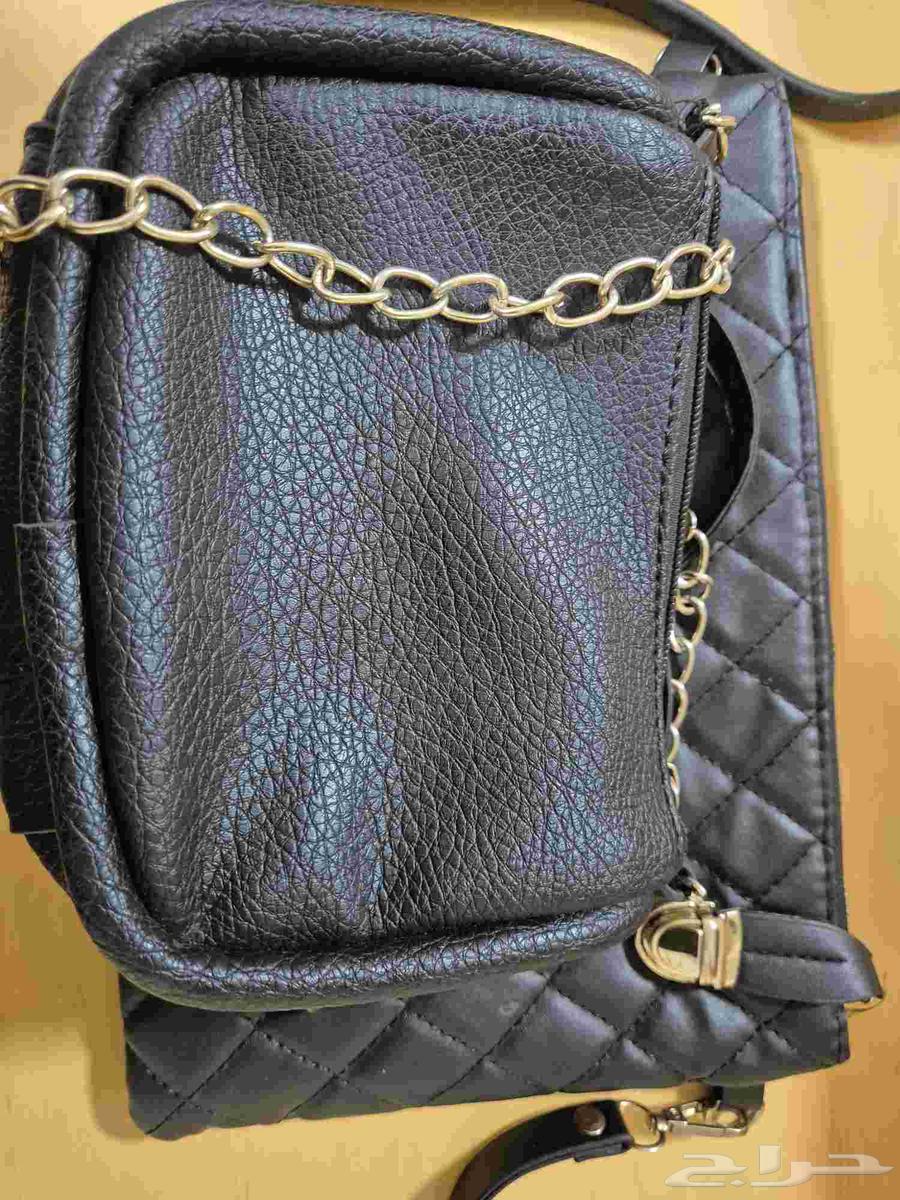 Two carpets 50 SAR, bags priced from 15 to 50 SAR, dining table 15064233486793091112