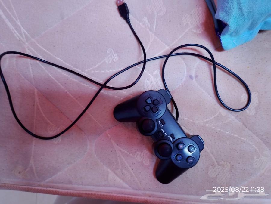 Two sets of PlayStation 2 controllers64264293249411110