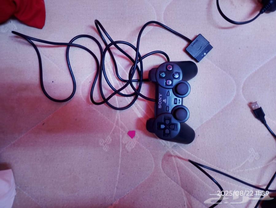 Two sets of PlayStation 2 controllers64264293249411111