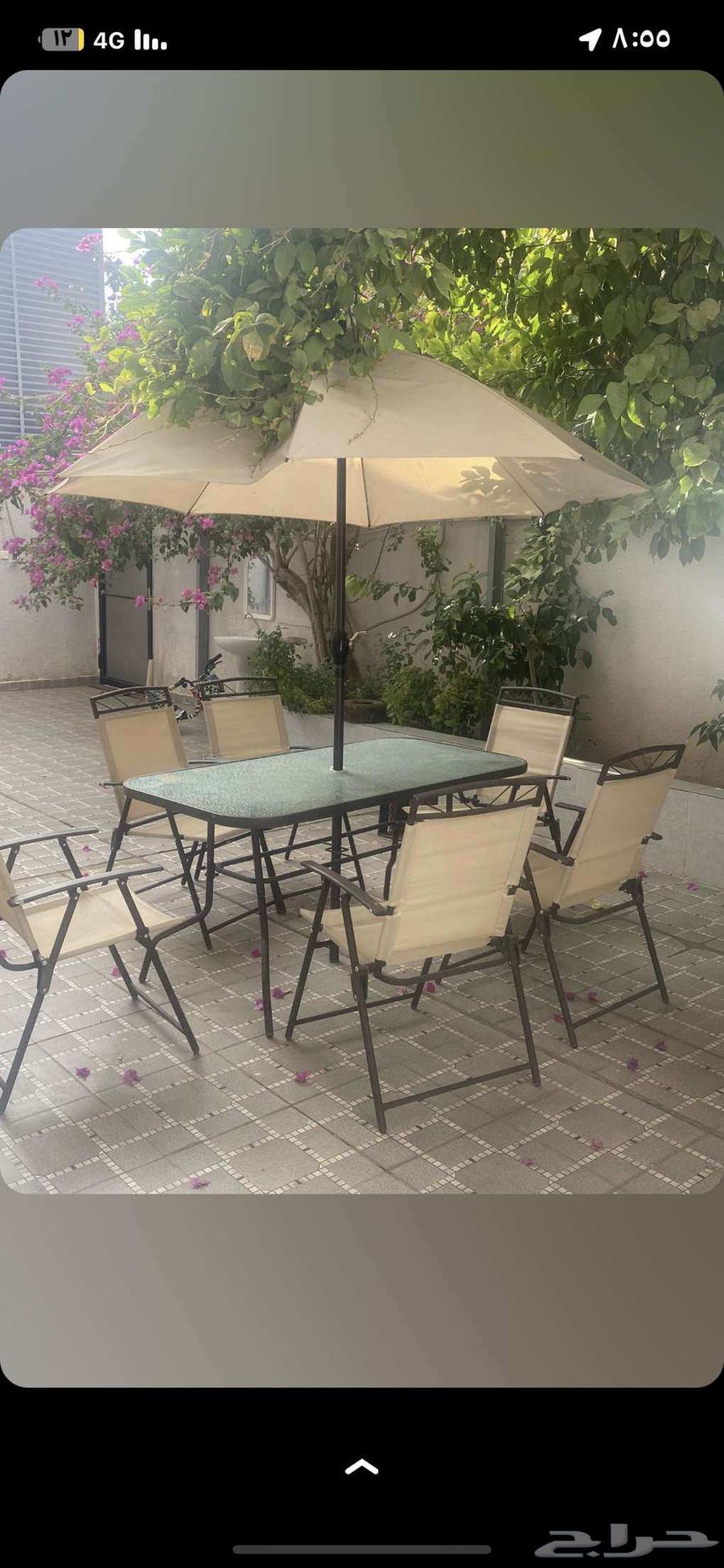 Table with 6 chairs and umbrella64383552627587110