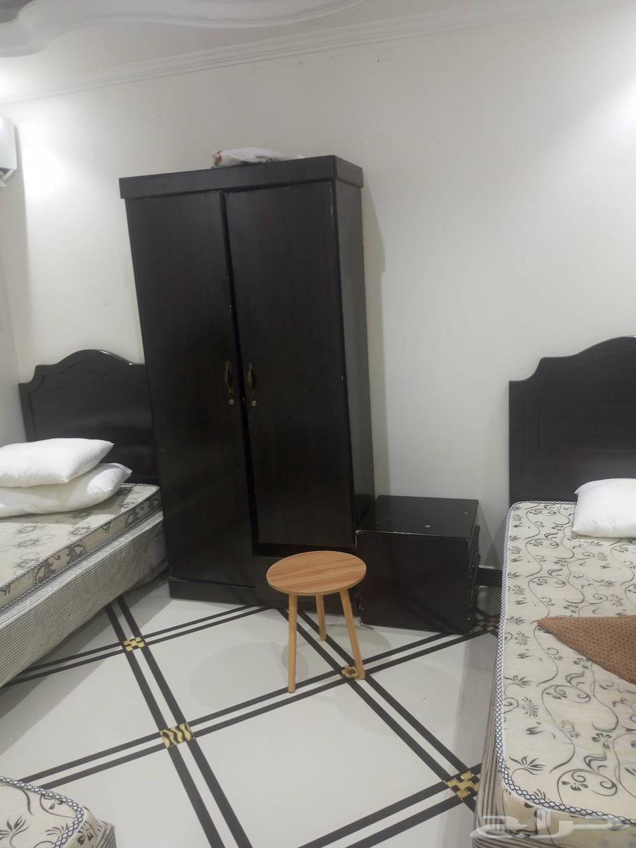 Three beds with a wardrobe and mattresses and two single beds with mattresses64396824995203110