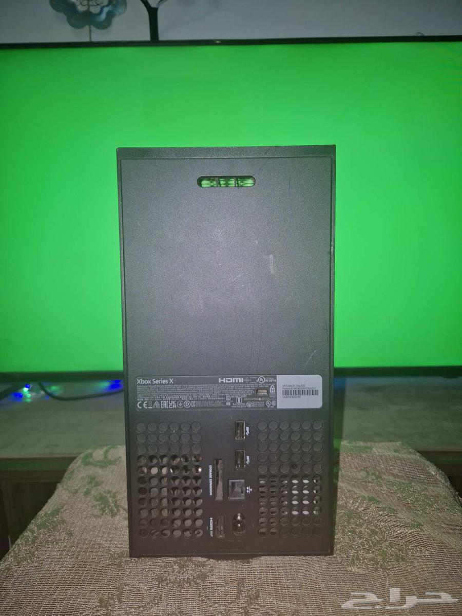 Xbox Series X with controller and FIFA64397561374979113