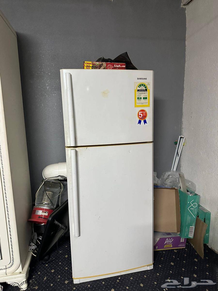 Two refrigerators, one large and one slightly smaller, and a split air conditioner for sale64485175108994112