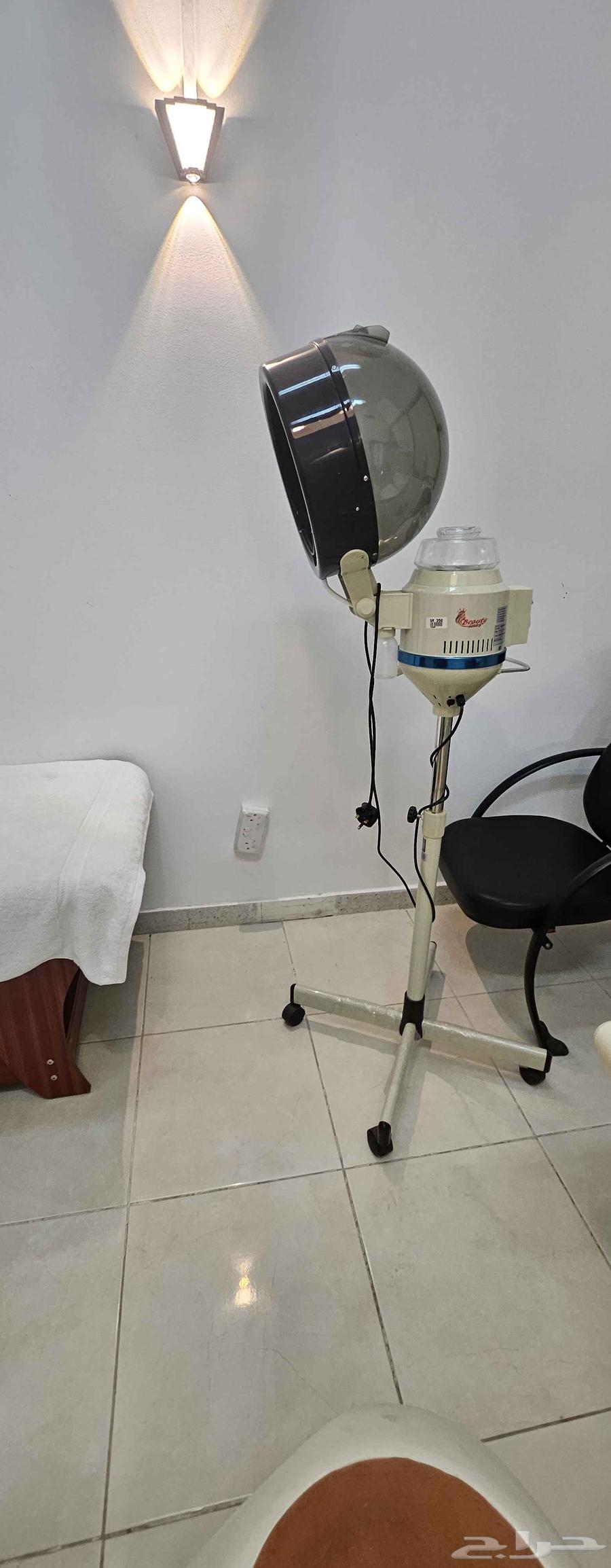 Two women's salon chairs with mirrors, sink, and steam machine64482064308737113