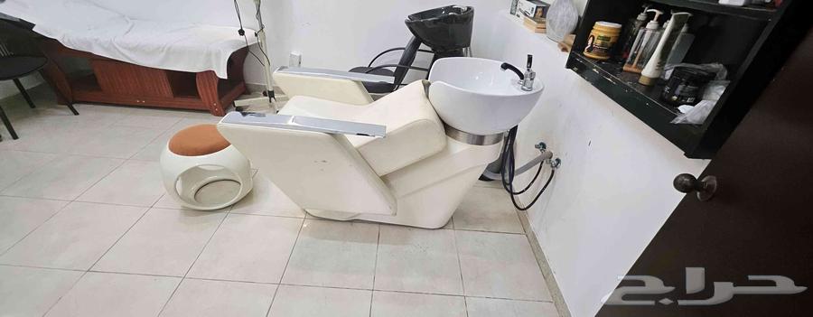 Two women's salon chairs with mirrors, sink, and steam machine64482064308737112