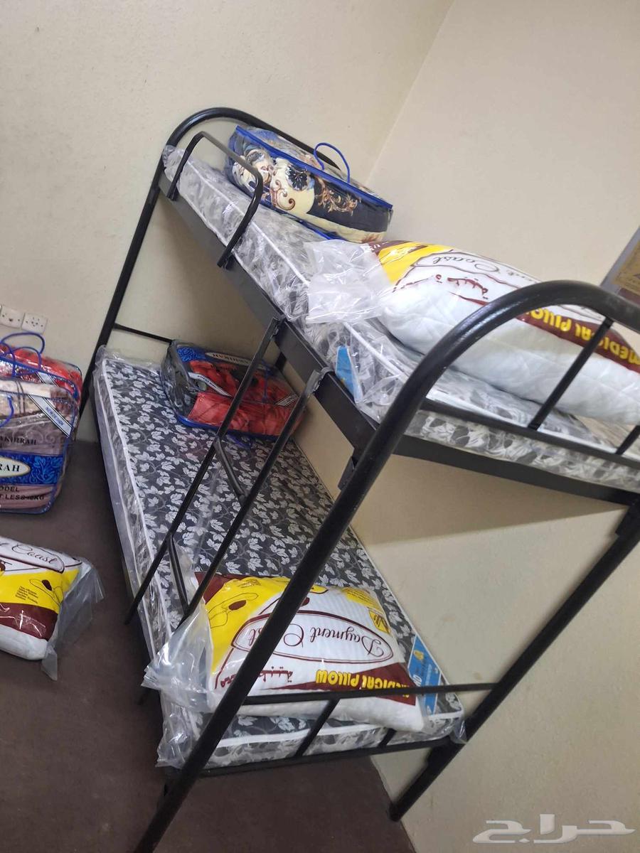 Iron double and single bunk beds with pillows, blankets, and new mattresses64494911801219110