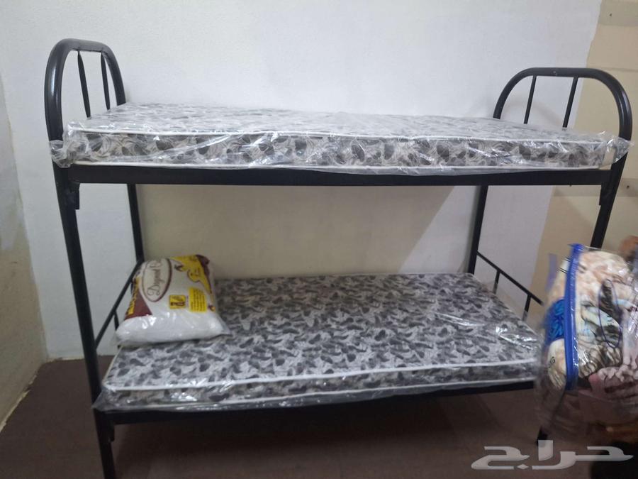 Iron double and single bunk beds with pillows, blankets, and new mattresses64494911801219111