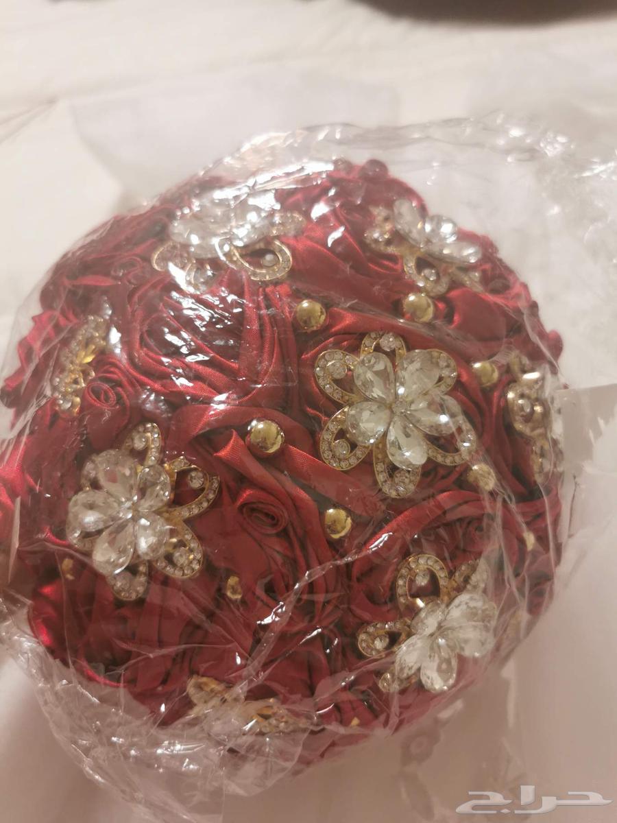 فستان زواج جديد ومسكه ورد جديده64504722492418110