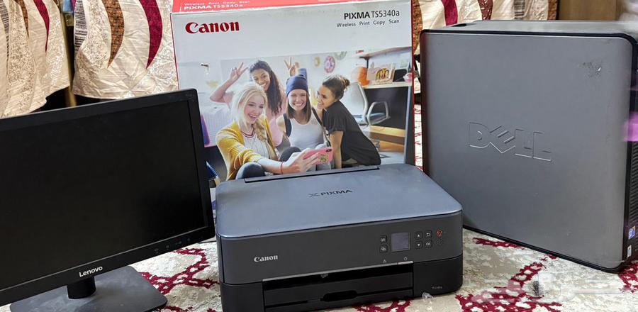 A computer with a screen and two printers64504626872835111