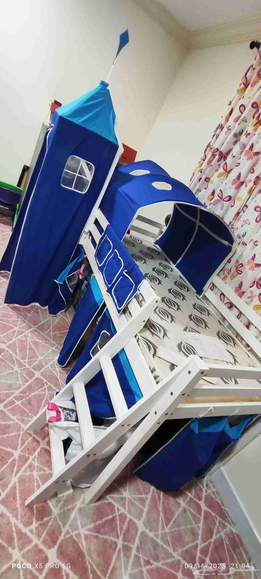 Elevated childrens bed with a ladder and slide64515542742531110