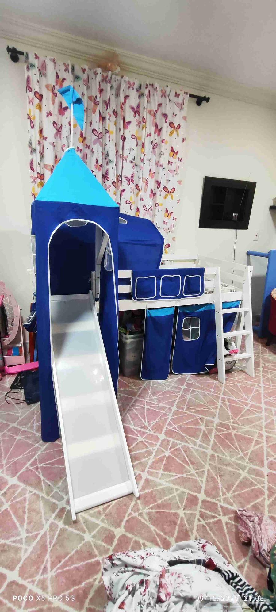 Elevated childrens bed with a ladder and slide64515542742531111