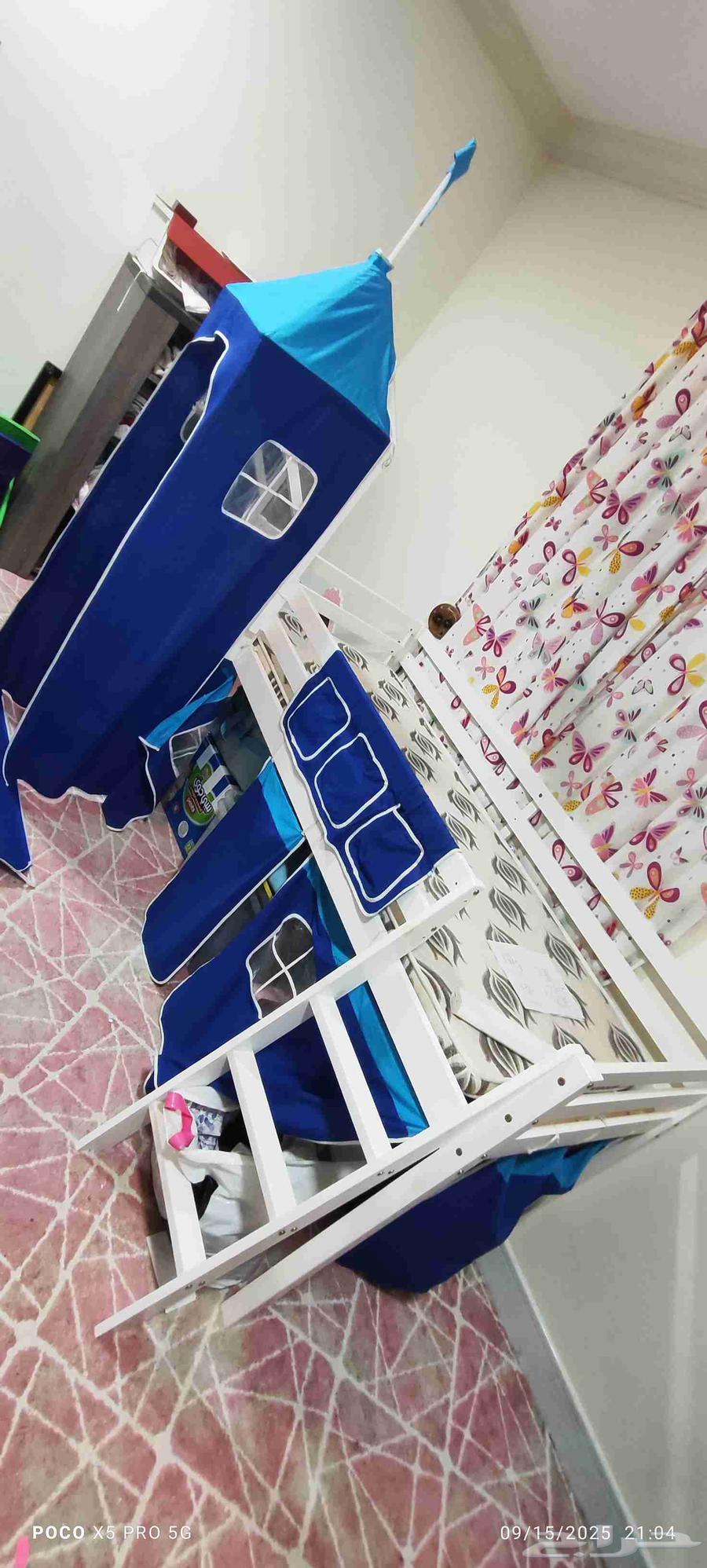 Elevated childrens bed with a ladder and slide64515542742531112