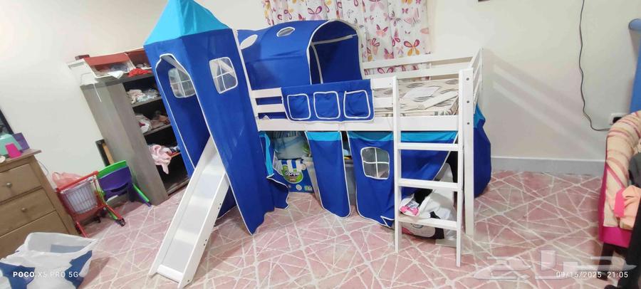 Elevated childrens bed with a ladder and slide64515542742531113
