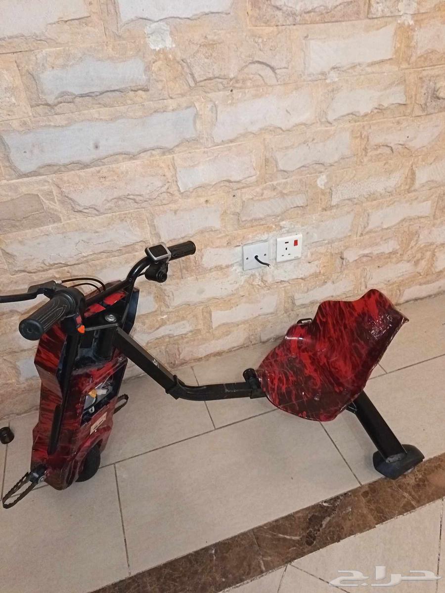 سكوتر احمر ليس معه سلك و بطاريه خربانه والكفر الخلف خربان64521723460995112