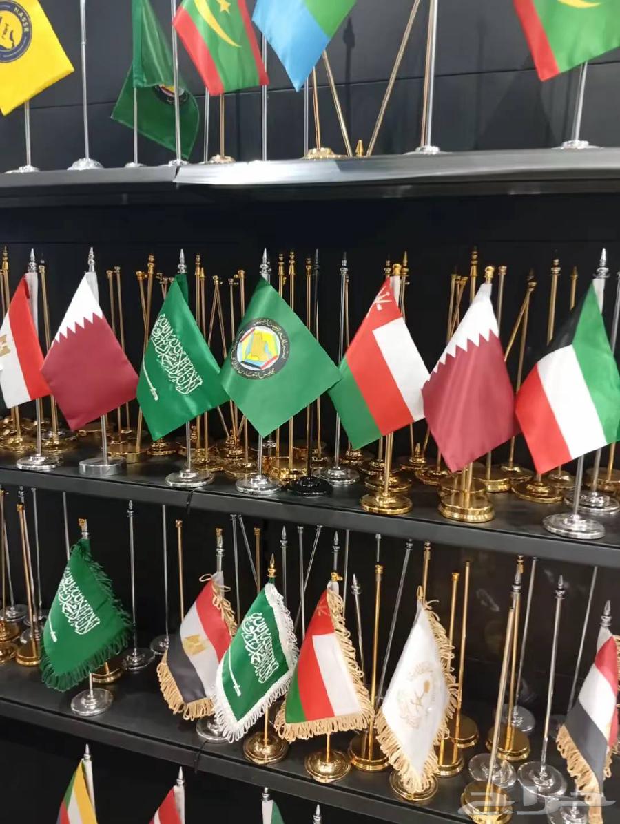 اعلام بشعار المملكة والشركة اعلام لليوم الوطني64527516682369112