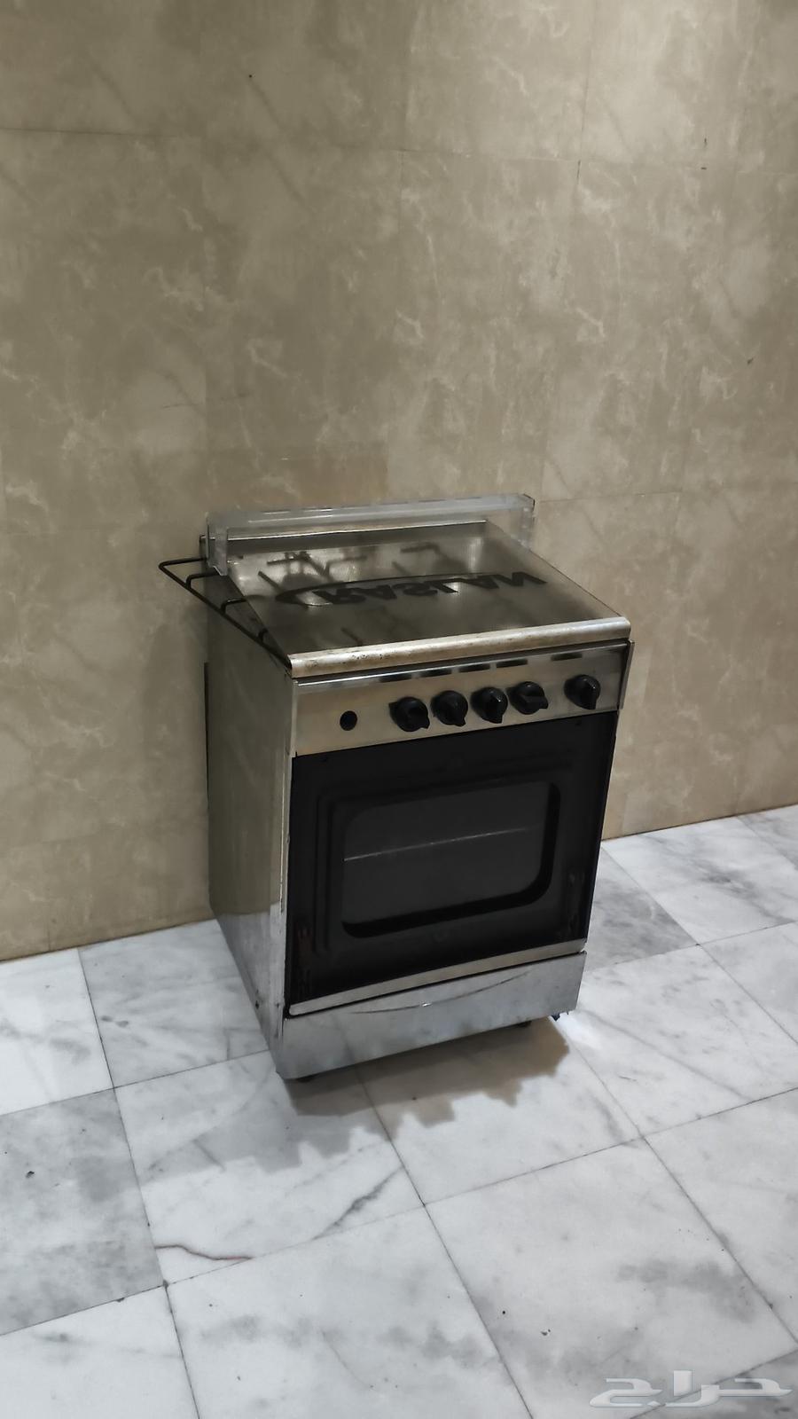 Egyptian refrigerator and four-burner oven for sale due to urgent need, interested parties may contact64527220763650111