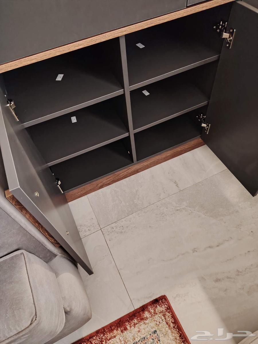 Modern gray and brown console, new, bought a month ago, selling for SAR 89964528351408387111