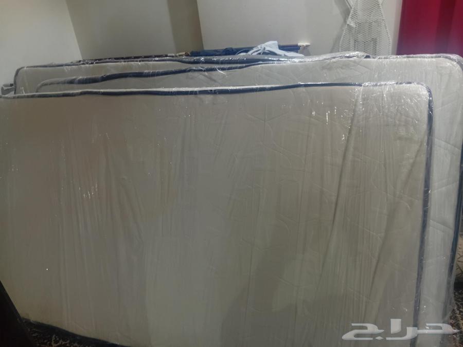 Three beds with mattresses and three tables, all for 60064534649068546113