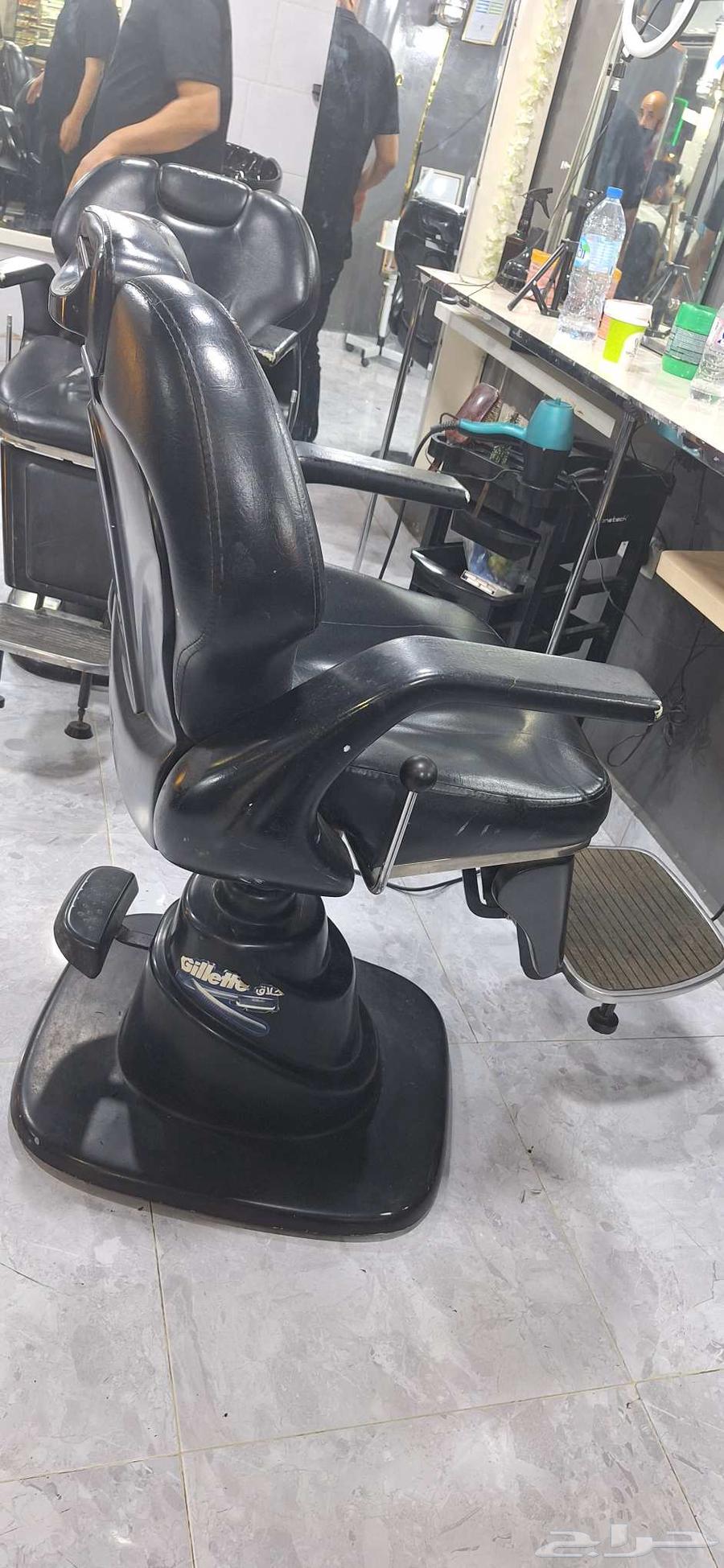 Three barber shop chairs, two in good condition and one with a cut in the middle64411821721347111