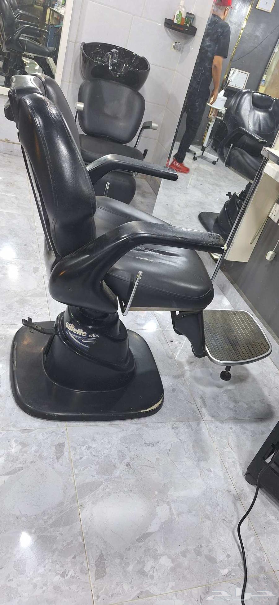 Three barber shop chairs, two in good condition and one with a cut in the middle64411821721347110