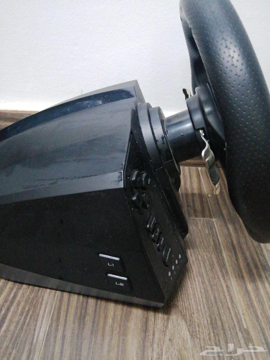 Steering wheel and normal gear shift and pedals with all their commitments64552547962626113