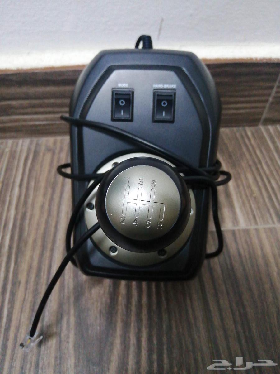 Steering wheel and normal gear shift and pedals with all their commitments64552547962626110