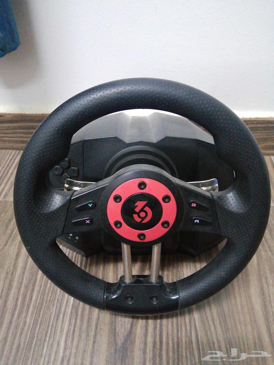 Steering wheel and normal gear shift and pedals with all their commitments64552547962626111