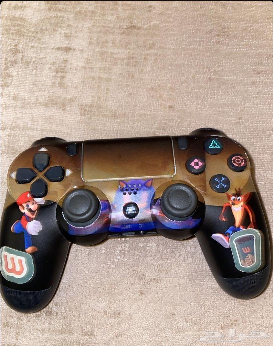 Sony 4 for sale with imitation controller, Grand Theft Auto tape, and cables64552463035523111