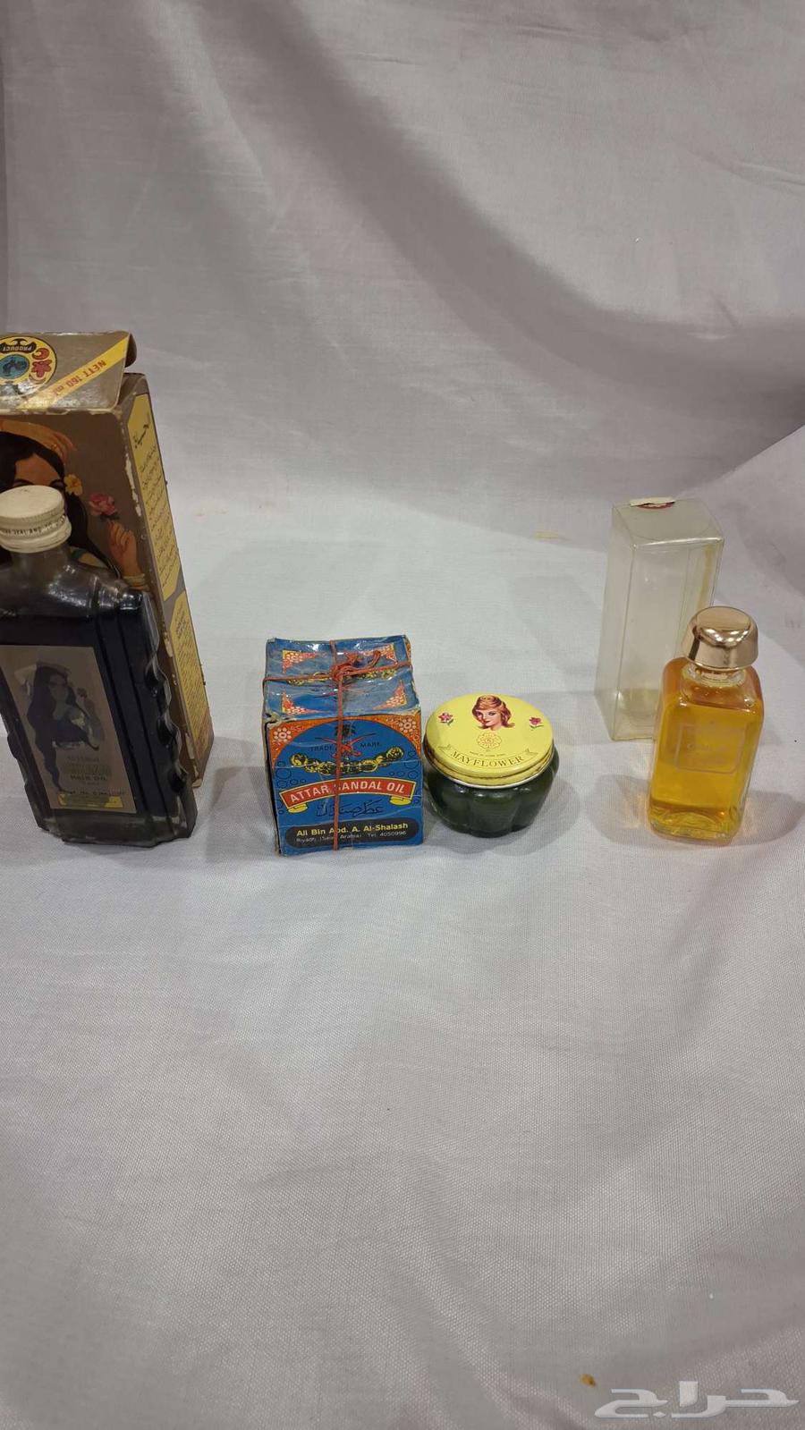 An old assorted set of sandalwood perfume and oil, all old and stored64593035271298110