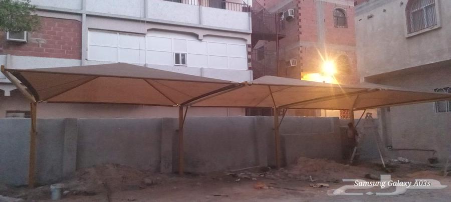 Car parking shades. Gardens and tensioned triangular structures64157323368321113