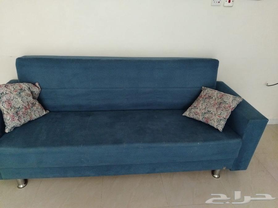 A navy-blue sofa from Home Box that converts into a bed with an internal storage box64614782284418110