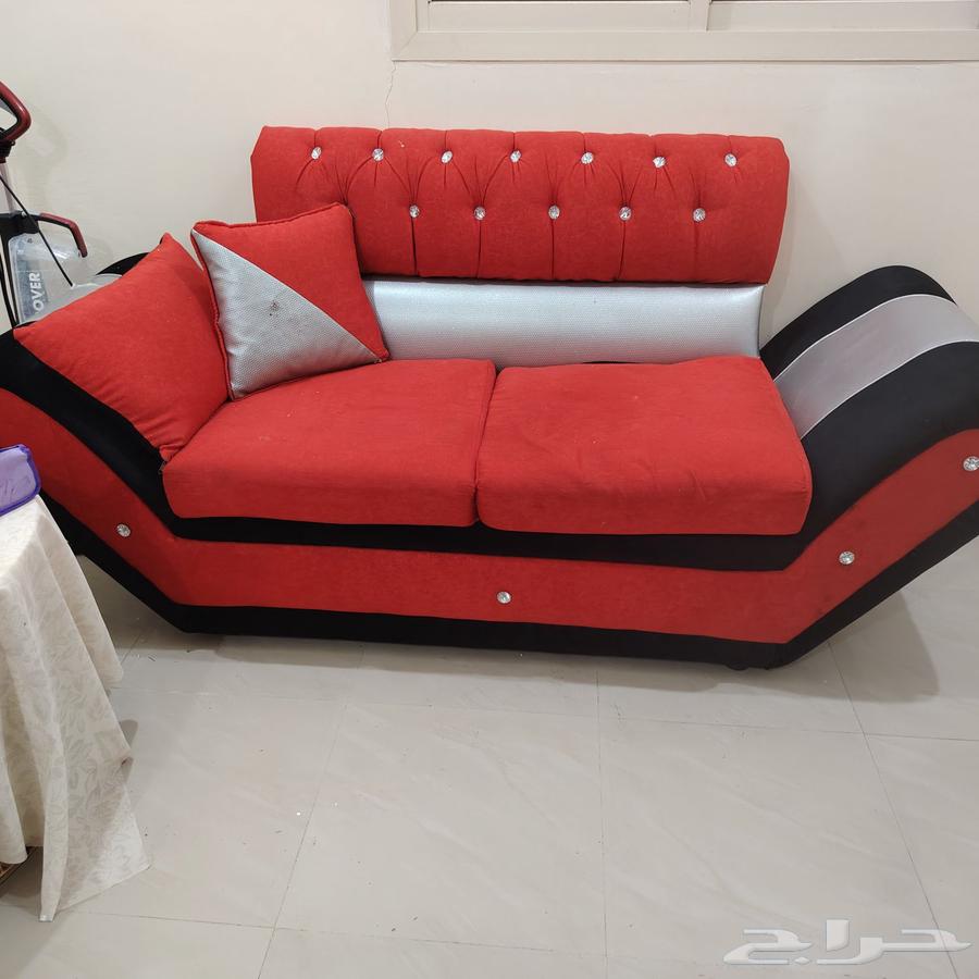 A navy-blue sofa from Home Box that converts into a bed with an internal storage box64614782284418114
