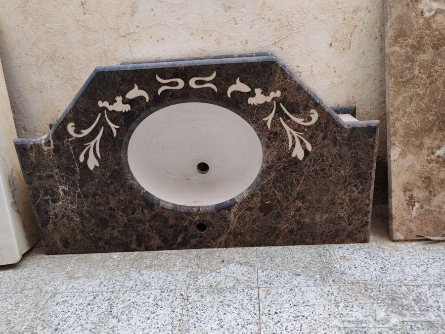 Exhibition of marble sinks, waterjet panel, and marble slab64415692714754111