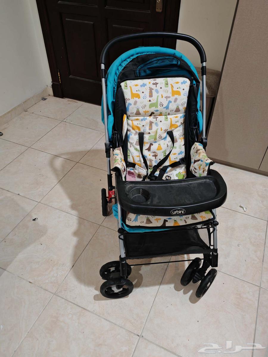 Office desk, computer, and baby stroller64419878802050111