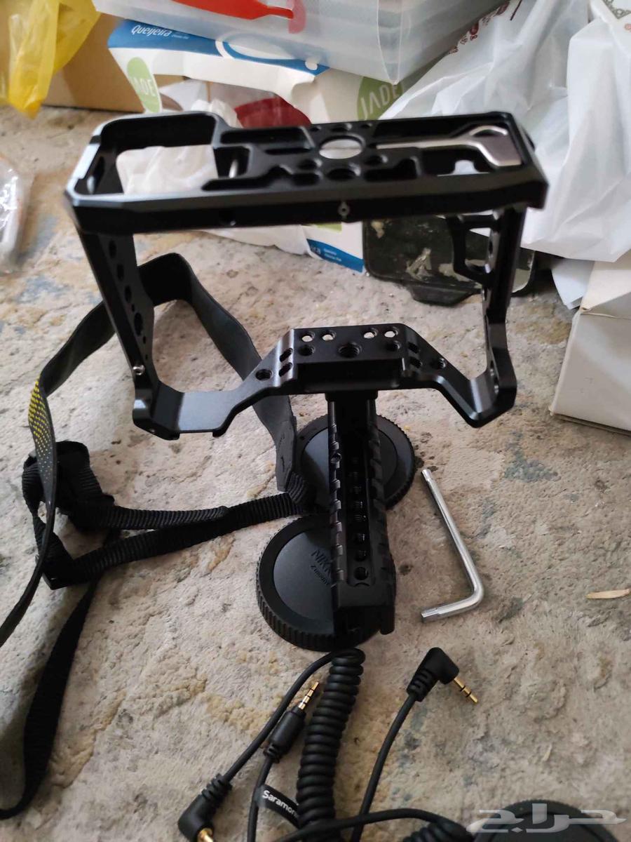 حامل قفص كاميرات بالمقبض اليد و غطاء عدسات كاميرات وشاحن64427569664642111