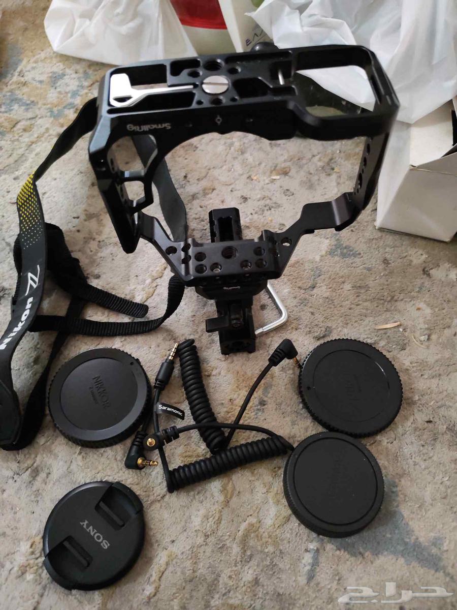 حامل قفص كاميرات بالمقبض اليد و غطاء عدسات كاميرات وشاحن64427569664642110