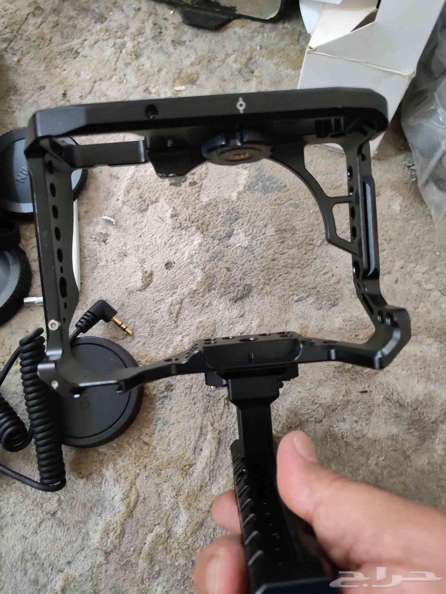 حامل قفص كاميرات بالمقبض اليد و غطاء عدسات كاميرات وشاحن64427569664642113