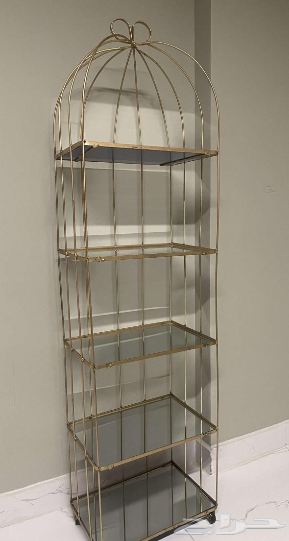 Half-body mannequin with one golden design and the other an iron shelf stand64448766791426114